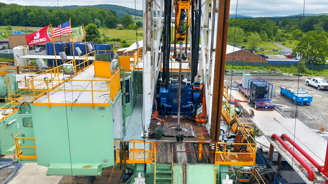 The rig platform during drilling, with extra sections of drill pipe ready to be attached as the hole gets deeper.