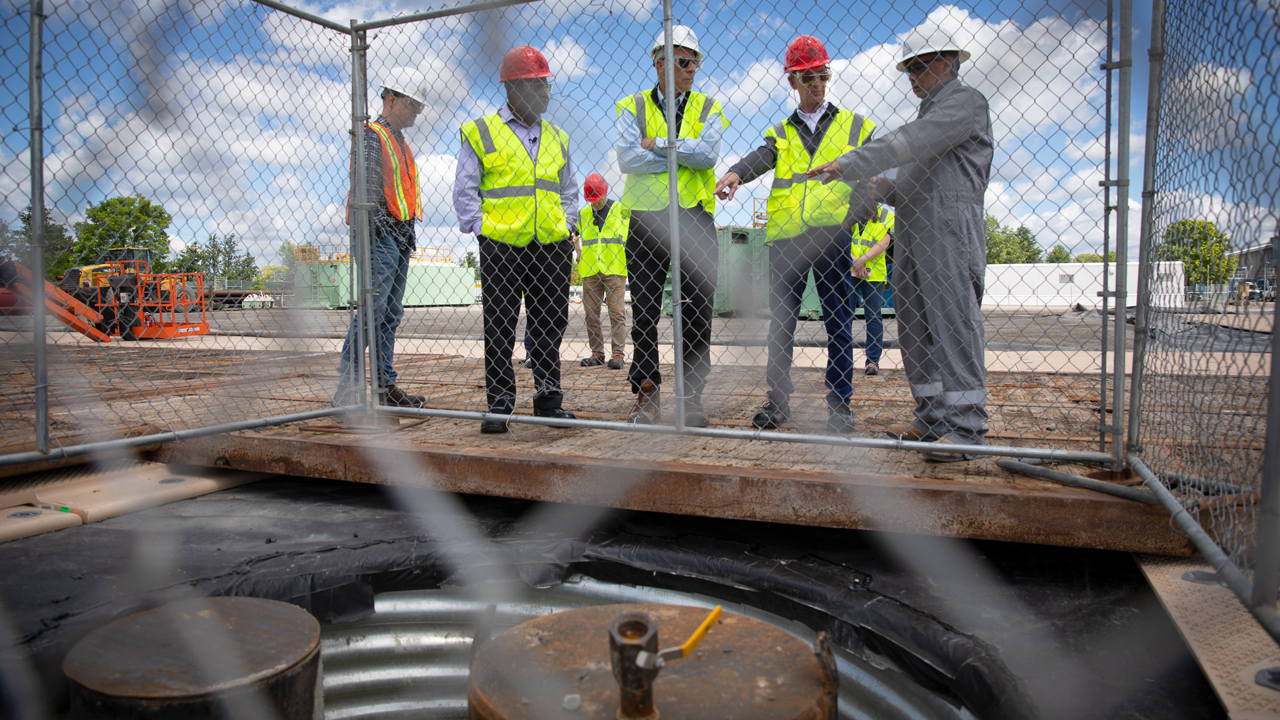 George Scheid, Capuano Engineering Company, the drilling site supervisor explains the drilling process to Lynden Archer, the Joseph Silbert Dean of Engineering, Bert Bland, associate vice president for energy and sustainability, and Bill Nye ’77 on June 10, 2022.